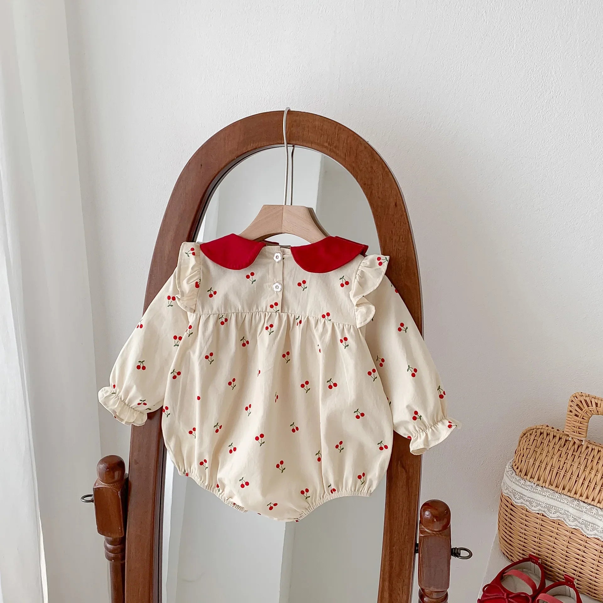 Long-sleeve cotton jumpsuit with cherry print