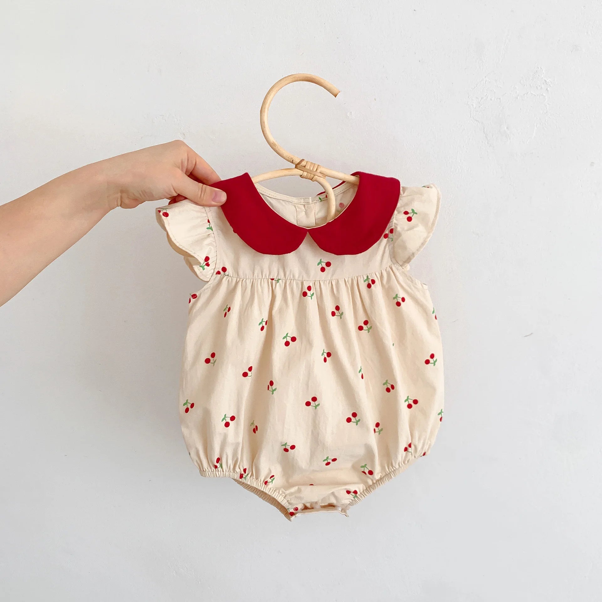 Long-sleeve cotton jumpsuit with cherry print