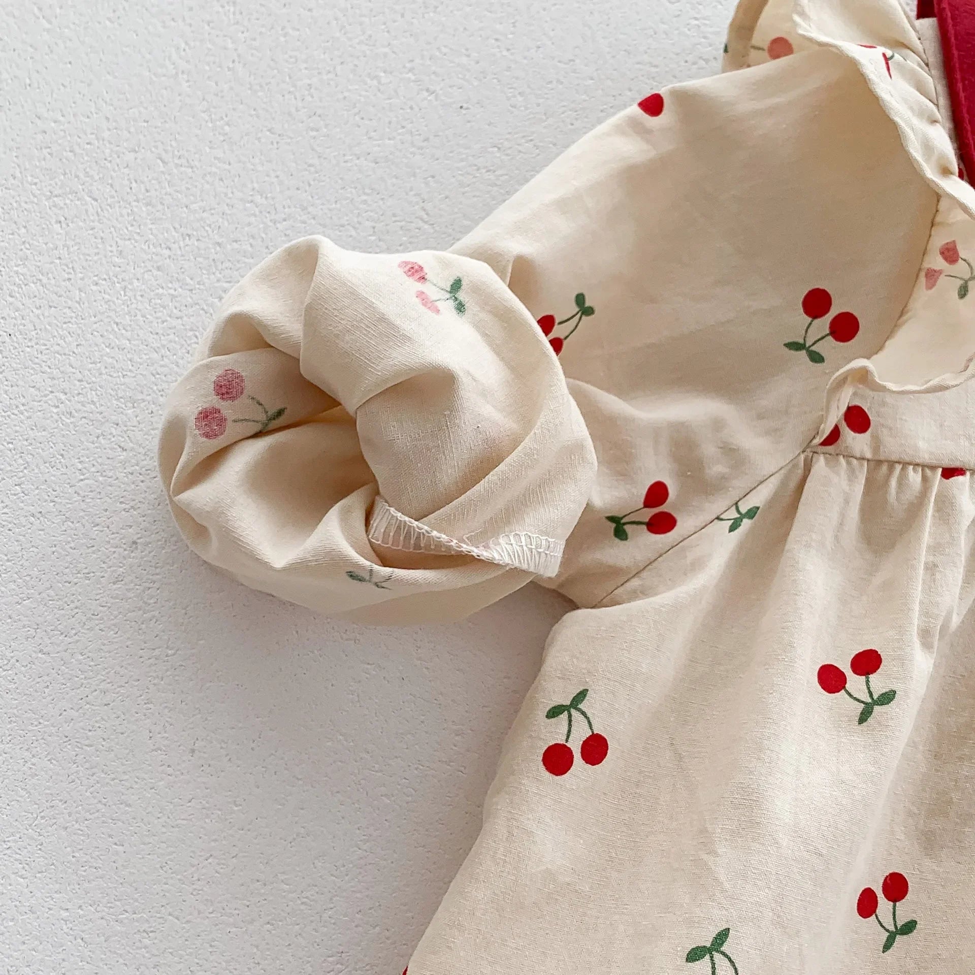 Long-sleeve cotton jumpsuit with cherry print