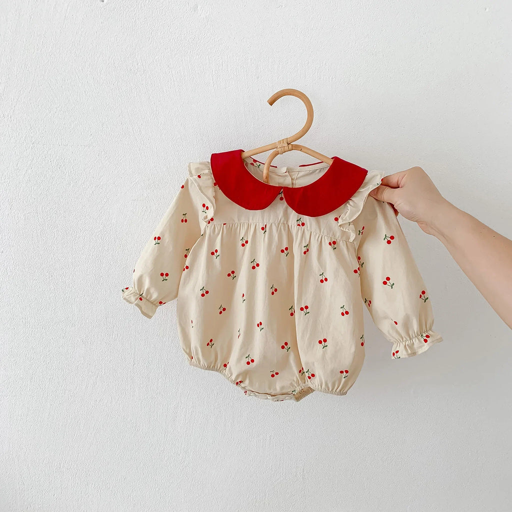Long-sleeve cotton jumpsuit with cherry print